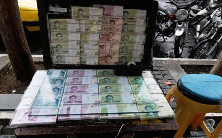 Iran's currency falls to a record low against the dollar as tensions run high