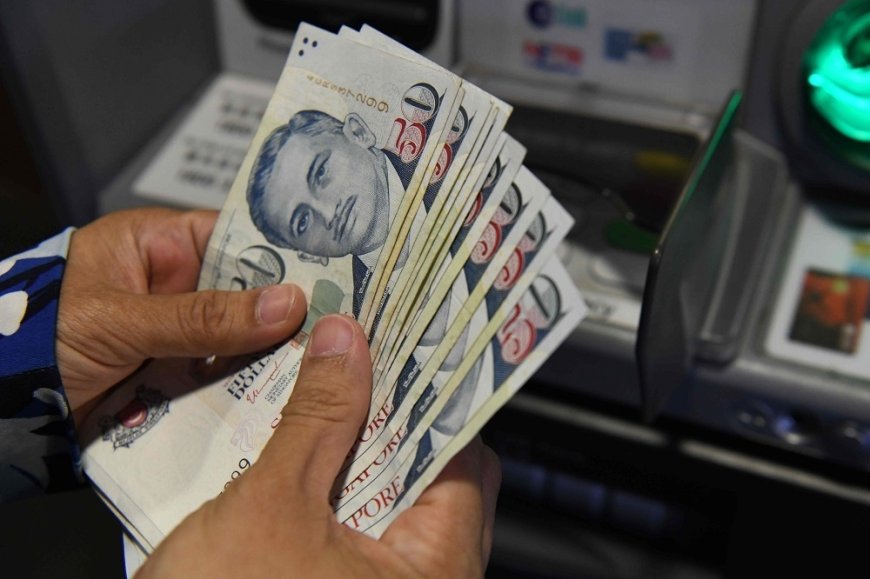 Report: Singapore dollar seen rising further, may reach parity with US dollar