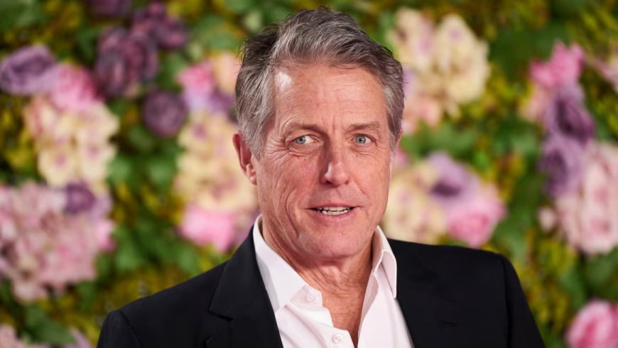 Hugh Grant looks to be one tired tennis fan at Wimbledon