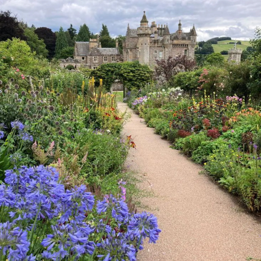"We walked from Melrose to Abbotsford, home of novelist Sir Walter Scott, and were rewarded with this lovely view of the house from the colourful walled garden," says Janice Taylor.