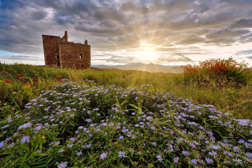 "Portencross Castle, North Ayrshire, with the sun setting over Arran in the distance," says Paul Cook.