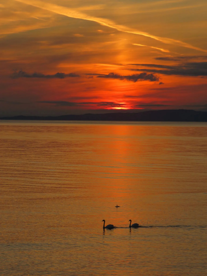 John Young from Stonehouse captured this stunning sunset over Killegruer, near Glenbarr in Argyll, from the beach looking to Islay in the distance.