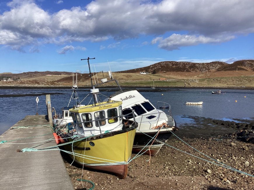 Boats moored in the natural sheltered harbour of Old Dornie on the Coigach peninsula, between Ullapool and Lochinver. Image: Andrea M. Borsden of Inverness