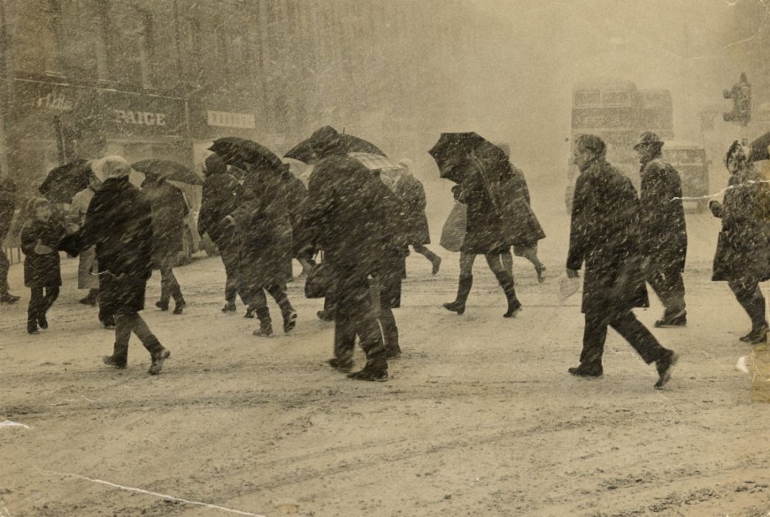 1969: Aberdonians lean against the blizzard as they scurry across Union Street at its junction with St Nicholas Street. Image: DC Thomson
