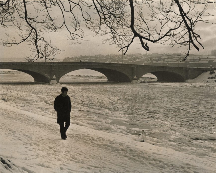 1969: A tranquil view of a lone walker by the frozen River Dee at the King George V Bridge, Aberdeen. Image: DC Thomson