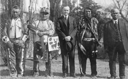 President Coolidge signs the Indian citizenship act to grant full rights