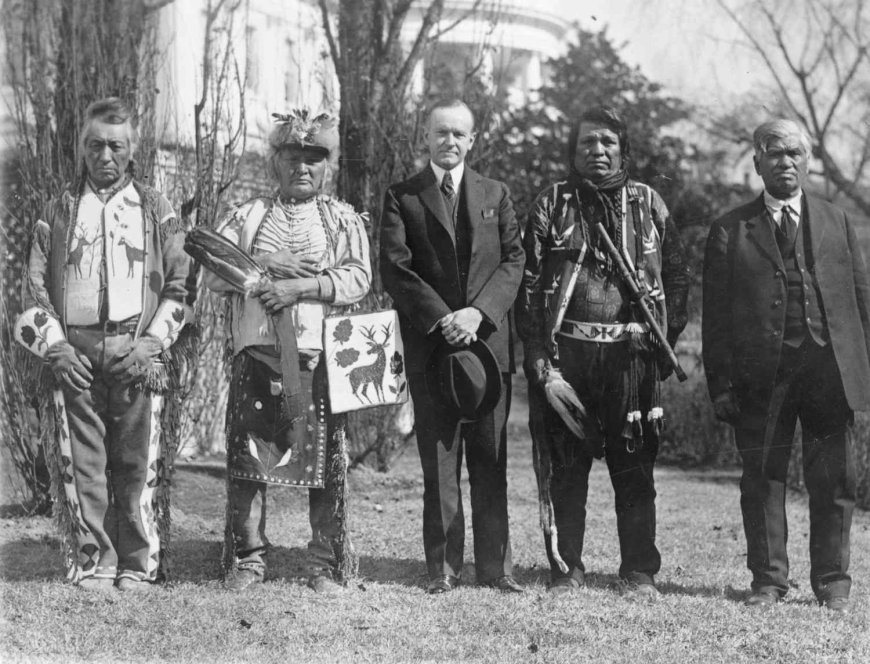 President Coolidge signs the Indian citizenship act to grant full rights